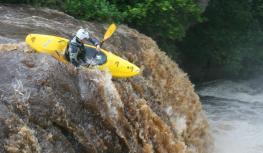 Canoeist going down Rainby Force, Park House Keld