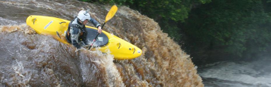 Canoeist going down Rainby Force, Park House Keld, Yorkshire